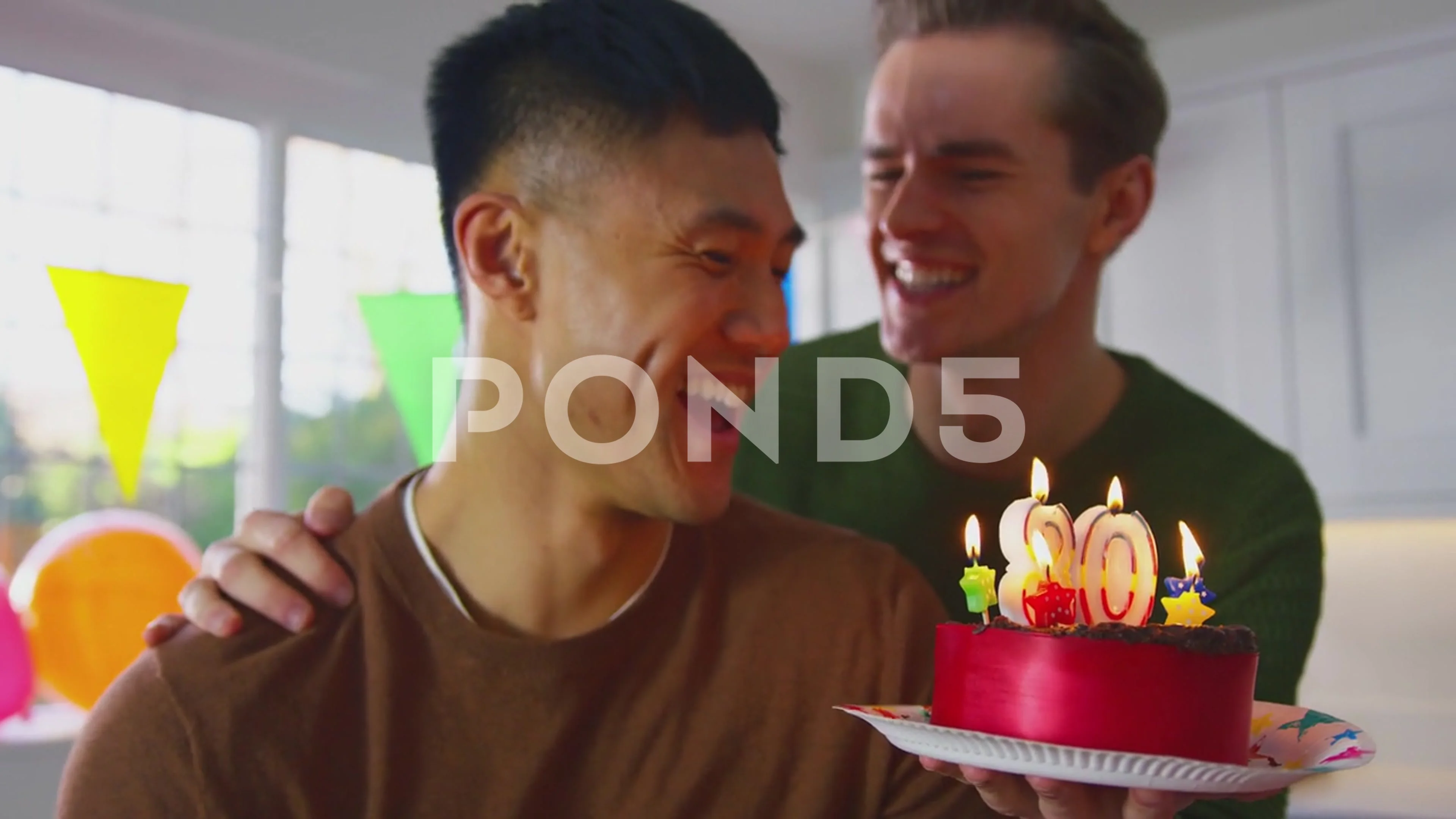 Same Sex Male Couple Celebrating 30th Birthday At Home With Cake And  Presents