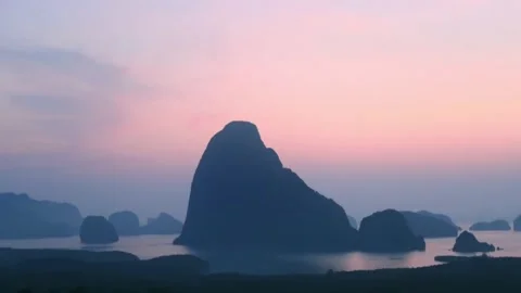 Samet Nangshe viewpoint at Phang Nga bay on cyan pink sunrise sky Stock Footage 186902646