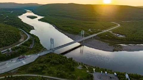 Sami Bridge and Teno river, summer, golden hour in Utsjoki Stock Photos