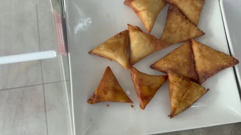 Samoosas in a plate on display at a fast food joint. Stock Footage 336300540