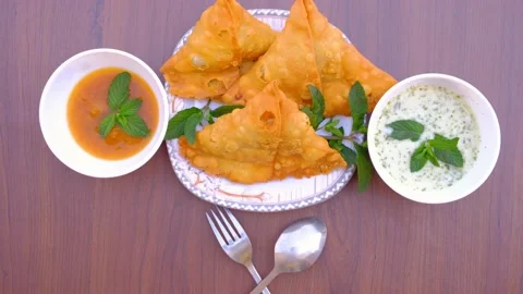 Samosa chaat. table spoon. samosa snack against natural background. samosa. Stock Footage 197481720