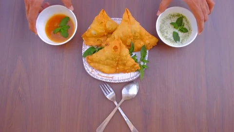 Samosa chaat. table spoon. samosa snack against natural background. samosa. Stock Footage 197482769