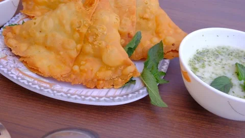 Samosa chaat. table spoon. samosa snack against natural background. samosa. Video stock 197495536