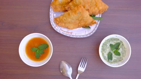 Samosa chaat. table spoon. samosa snack against natural background. samosa. Stock Footage 197495603