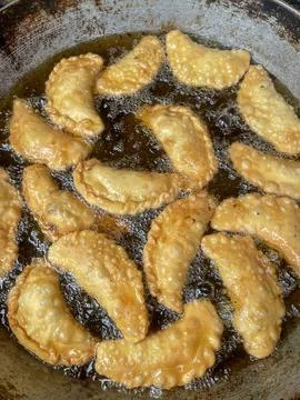 Samosas being fried. Stock Photos