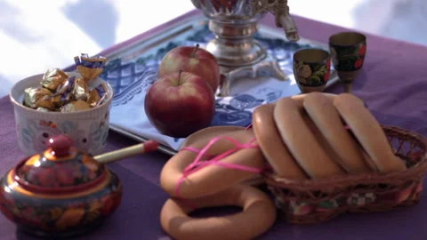 Samovar bagels apples sweets in winter on the table Stock Footage 167467699