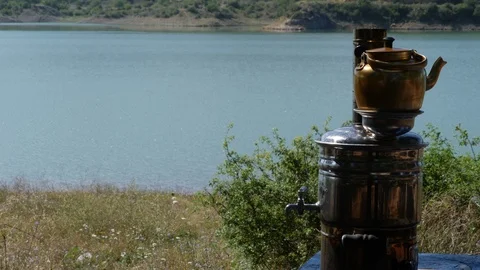 Samovar tea by the lake 4K Stock Footage 113191284