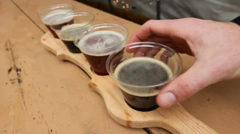 Sample of beers, man takes one, slider Stock Footage 36229532
