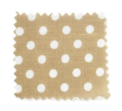 Sample of beige fabric with polka dot pattern isolated on white, top view Fotos de archivo