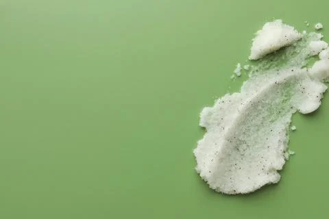 Sample of body scrub on green background, top view. Space for text Stock Photos