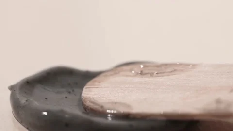 Sample charcoal mask, scrub for cleansing and restoring the skin close-up. Stock Footage 232371421