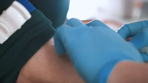 Sample collection secured by trained medical personnel primarily. Medical team Stock Footage 345531002