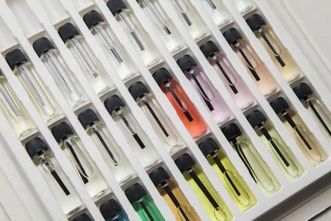 Sample of colored perfume bottles with different types of fragrances and arom Stock Photos