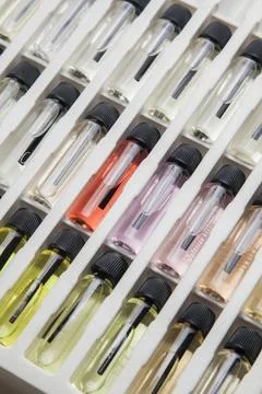 Sample of colored perfume bottles with different types of fragrances and arom Stock Photos