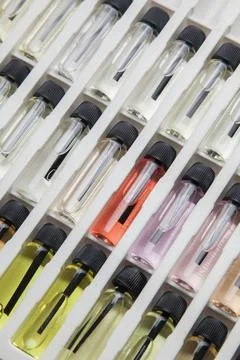 Sample of colored perfume bottles with different types of fragrances and arom Stock Photos