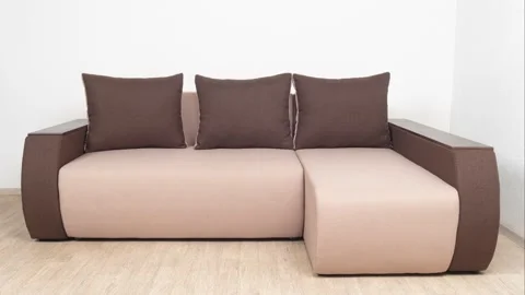 A sample of a corner brown sofa. Minimalistic interior. Video stock 155495979
