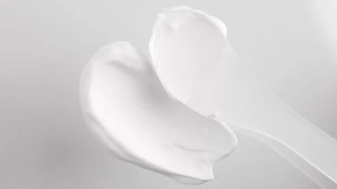 A sample of a cosmetic cream on a light background in the shape Stock Footage 222752243