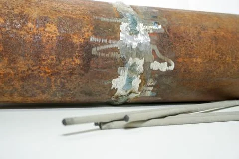 Sample of defective weld on the background Welding electrode  for testing in  Stock Photos