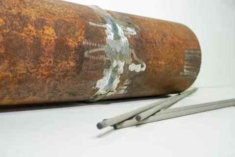 Sample of defective weld on the background Welding electrode  for testing in  Stock Photos