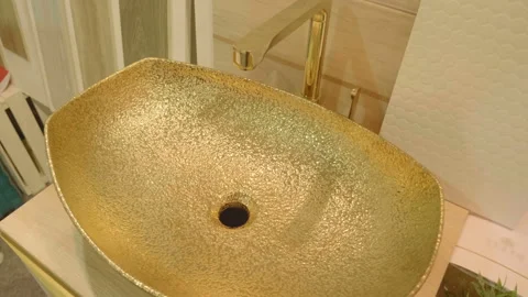 Sample of expensive gilded sink and faucet at an exhibition Stock Footage 111139501
