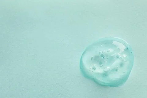 Sample of face gel on light blue background, top view. Space for text Stock Photos