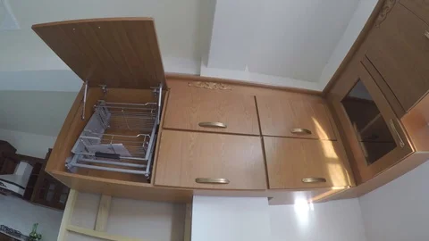 Sample kitchen cabinet on the wall. upper door opend Stock Footage 97264901