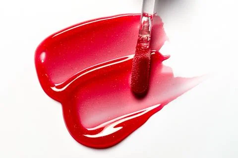 A sample of lip moisturizer on a white background. Oil or lip balm. Stock Photos