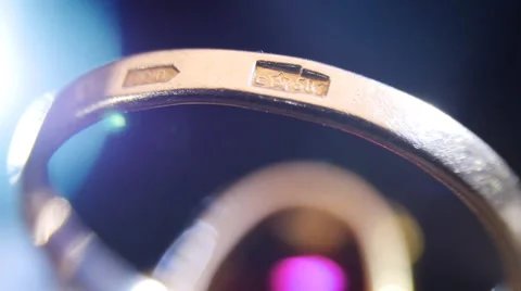 The sample, the mark on a gold ring with red ruby Stock Footage 45305506