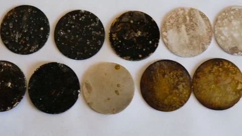 Sample metal round shape with different degrees of corrosion. Top view, camera m Stock Footage 85368887