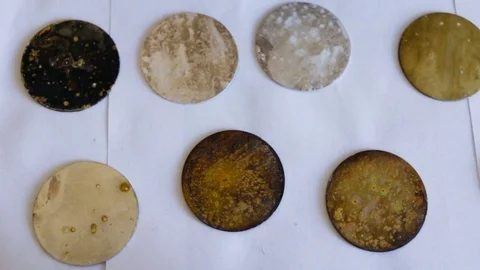 Sample metal round shape with different degrees of corrosion. Top view, part of Stock Footage 85369154