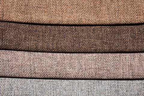 A sample of multi-colored textures of fabrics.Background of different fabrics. Stock Photos