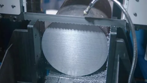 A sample of a new band saw machine that cuts huge metal rod at the exhibition Stock Footage 340627063
