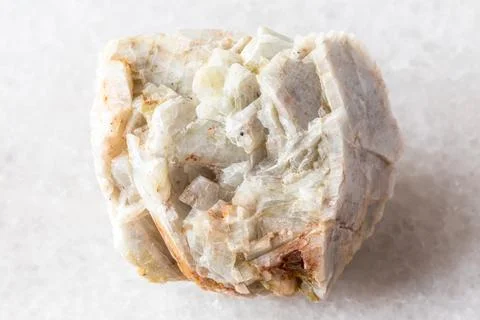 Sample of raw albite mineral on white marble Stock Photos