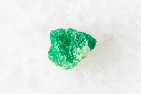 Sample of raw emerald mineral on white Stock Photos