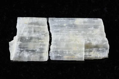 Sample of rough eudidymite mineral on black Stock Photos
