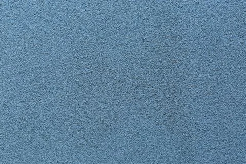 Sample of a texture of blue plaster. Wall finished with a decorative cement s Stock Photos