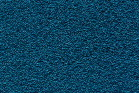 Sample of a texture of blue plaster. Wall finished with a decorative cement Stock Photos