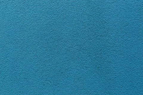 Sample of a texture of blue plaster. Wall finished with a decorative cement.. Stock Photos