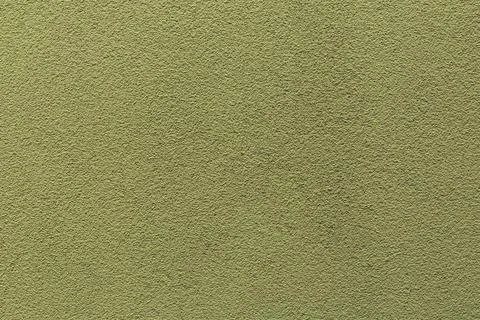 Sample of a texture of khaki plaster. Wall finished with a decorative cement  Stock Photos