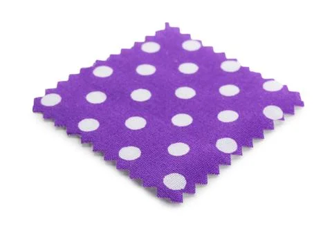 Sample of violet fabric with polka dot isolated on white Fotos de archivo