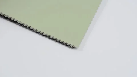 Samples of artificial leather. Multicolored sheets of leather are placed on the  Stock Footage 157045895