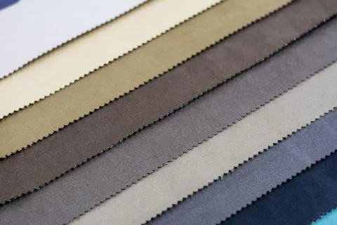 Samples of artificial suede. Sheets of suede fabric close-up. Stock Photos