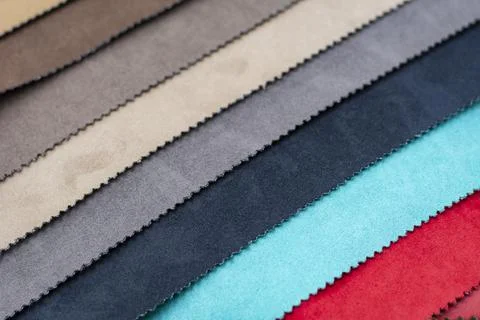 Samples of artificial suede. Sheets of suede fabric close-up. Stock Photos