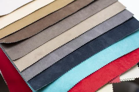 Samples of artificial suede. Sheets of suede fabric close-up. Stock Photos
