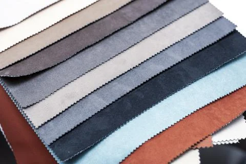 Samples of artificial suede. Sheets of suede fabric close-up. Stock Photos