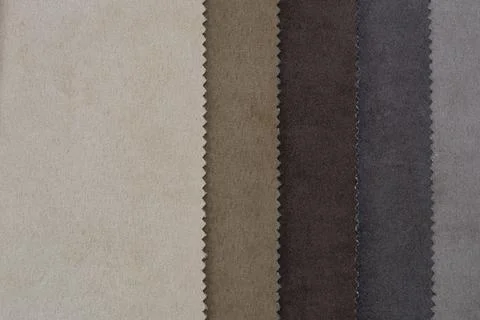 Samples of artificial suede. Sheets of suede fabric close-up. Stock Photos