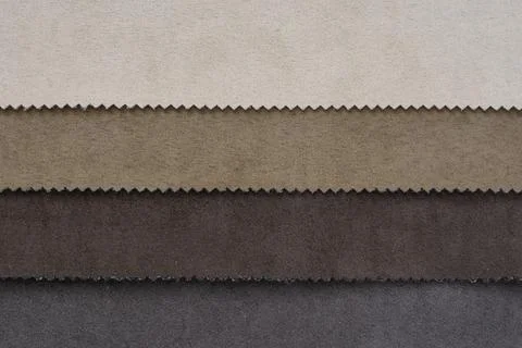 Samples of artificial suede. Sheets of suede fabric close-up. Stock Photos