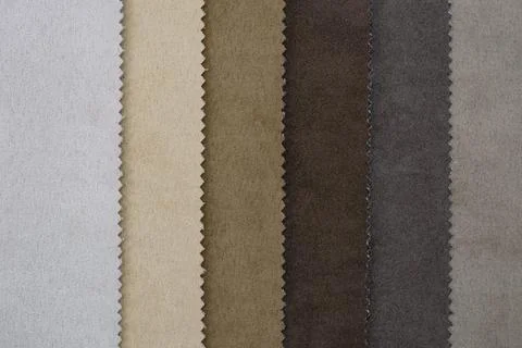 Samples of artificial suede. Sheets of suede fabric close-up. Stock Photos