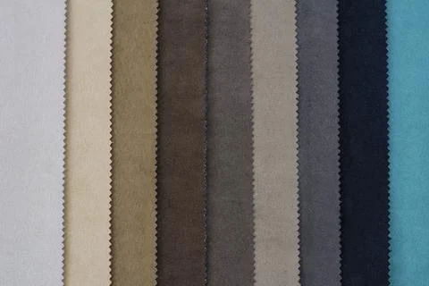 Samples of artificial suede. Sheets of suede fabric close-up. Stock Photos