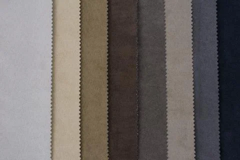 Samples of artificial suede. Sheets of suede fabric close-up. Stock Photos